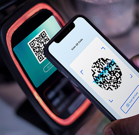 A phone scans the qr code